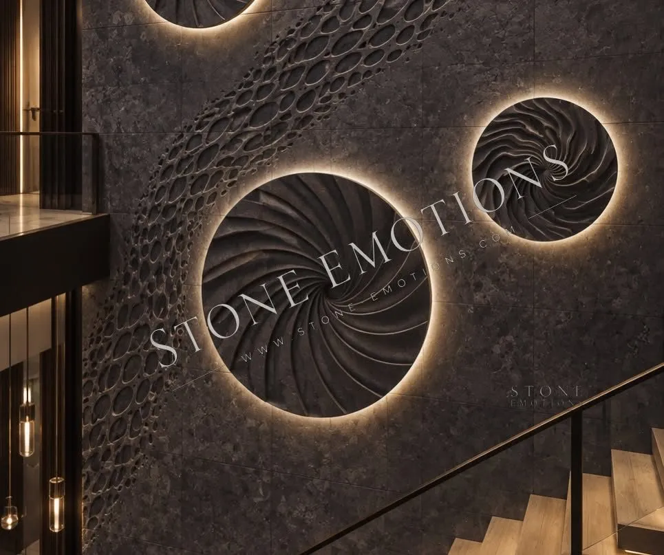Charcoal staircase wall with backlit circular 3D-carved discs and pebble texture