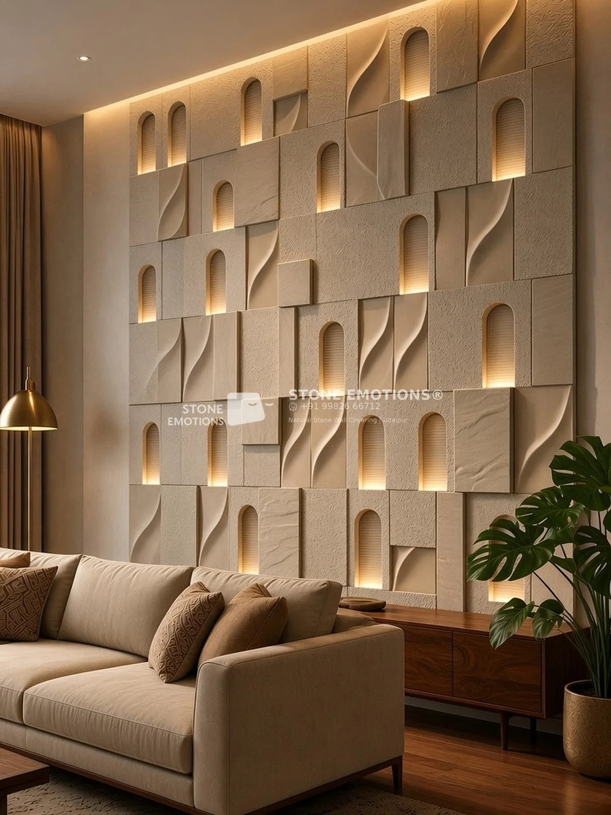 Jharokha 3D stone mosaic wall in warm beige-buff Gwalior sandstone behind a living room sofa: arch niches with horizontal fluted grooves lit by a warm LED uplight hidden in each bottom sill, S-curve wave tiles, rock-face, sandblasted and honed tiles at varied depths